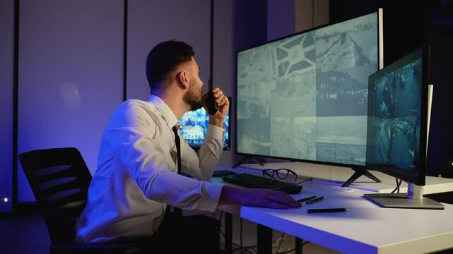 Angry security officer monitoring CCTV and shouting on radio