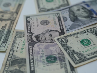 US dollar bills on clean white background. Premium quality image with perfect detailing. Ideal for presentations, financial reports, banking advertisements and business projects