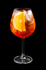 Glass of aperol spritz cocktail black background