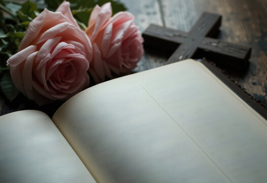 Open Book, Roses, and Cross on Wooden Surface for Remembrance