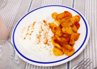 Delicious sliced sweet apple with cottage cheese served on plate for dessert