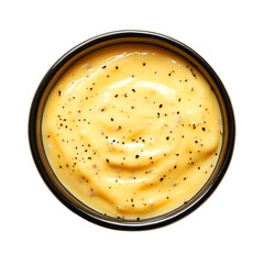 Creamy Yellow Sauce in Black Bowl with Pepper