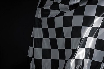 One racing checkered flag on black background, space for text