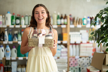 Happy girl shopping presents at home goods store