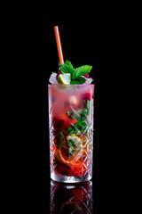 strawberry mojito with fresh mint, lime, and crushed ice on a black background