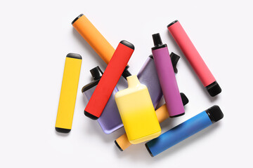 Different electronic cigarettes on white background