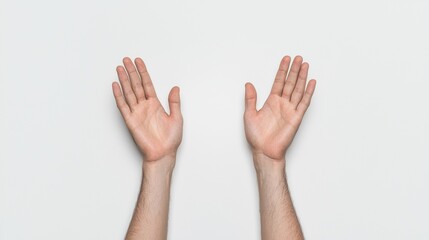 Two hands are raised with open palms against a plain light background, symbolizing openness, greeting, or celebration.