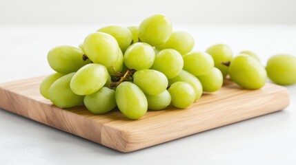 Fresh Green Grapes on Rustic Wooden Cutting Board Displaying Natural Beauty