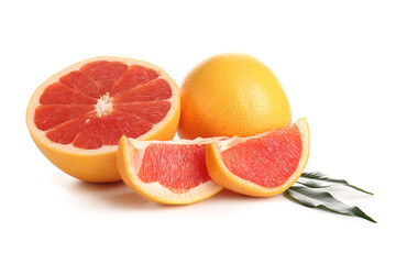 Cut fresh grapefruits and leaves on white background