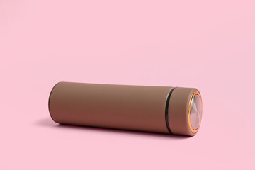 Brown modern thermos on pink background