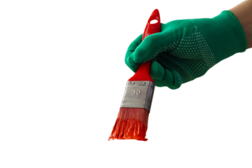 Hand in green glove grips a paintbrush, isolated on white, PNG