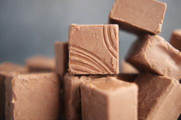 Delicious chocolate fudge squares arranged artistically on a surface