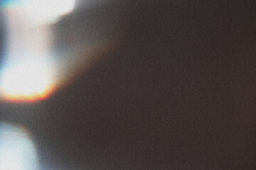 Colorful glow Light flare sparks texture. Red orange rays on dark blue abstract overlay.