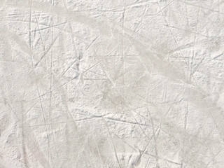 Ice background with marks from skating and hockey. Ice hockey rink scratches surface