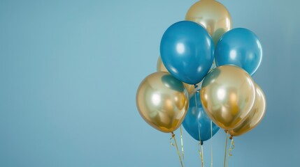 bouquet of blue and gold balloons on solid background, room for copy