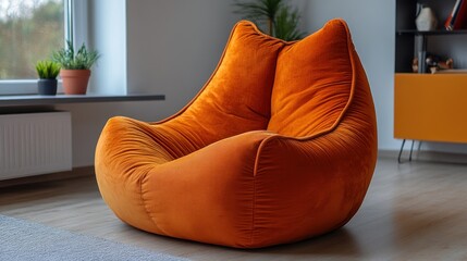 Orange velvet beanbag chair in modern living room.