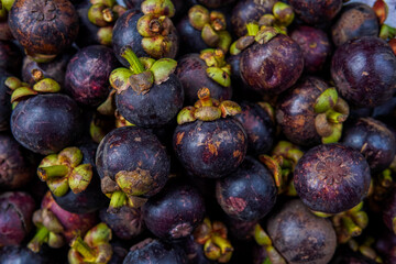 Mangosteen fruit in the basket at the top angle.
