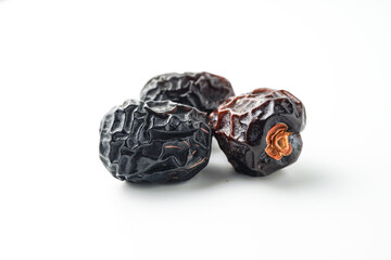 Dates fruit ajwa or kurma ajwa, isolated on white background