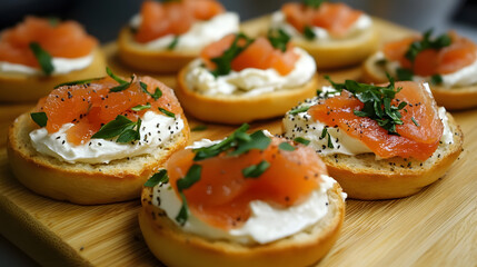 Delicious smoked salmon and cream cheese canap?s garnished with fresh herbs on a wooden platter