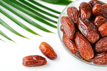 Dates fruit tunisia, Tunisian honey dates, in bowl isolated on white background