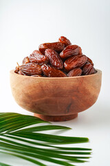 Dates fruit tunisia, Tunisian honey dates, in bowl isolated on white background