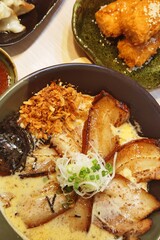 Japanese traditional ramen with other dishes on table