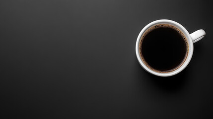 white cup filled with black coffee sits on dark surface