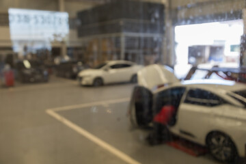 Obraz premium blured image of car service centre auto repair workshop