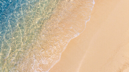 Nature of the beach and sea Summer with sunshine, sandy beaches, clear blue waters sparkling against the blue sky. On an island with good ecology and environment Background for summer vacation