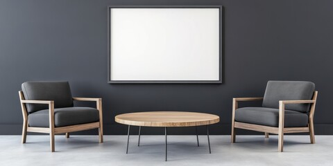 Two gray armchairs flank a round table under a framed art
