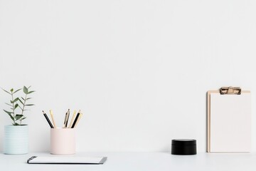 capture elegant and modern scene featuring plain monochrome surface like table or desk with assortment of everyday