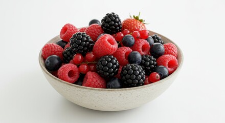 A Speckled Bowl of Mixed Berries on White Background