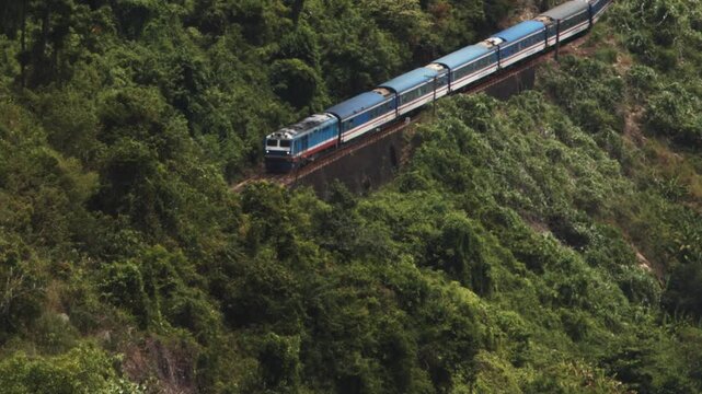 Train passes on coastal route, Hai Van Pass, Vietnam