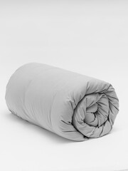 Rolled up duvet side view photo