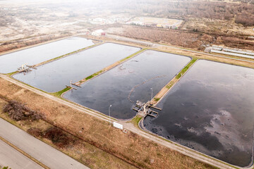 Sewage ponds aerial view, water purification process and environmental protection, depicting sustainable waste management approach and modern ecological infrastructure.