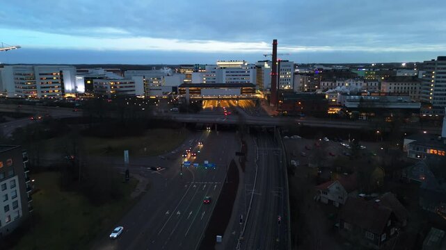 Aerial view away fromt the illuminated Kupittaa railway station, evening in Turku