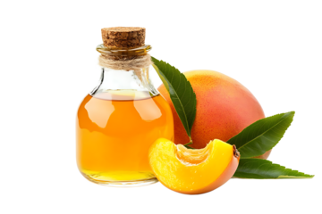 Glass bottle filled with oil next to a peach and a peach slice with green leaves on a black background
