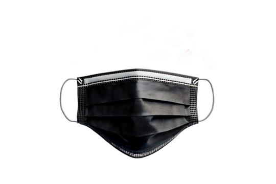 A black face mask with white trim and colorful pills floating above it on a black background