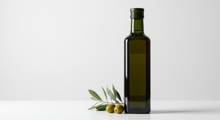 Naklejka premium Green Olive Oil Bottle with Olives and Branch on White Background