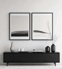 Minimalist grayscale landscape art prints above modern console.