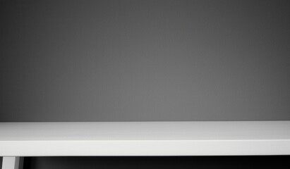 Obraz premium Minimalist White Table Against Dark Gray Background for Interiors