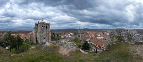 Scenic View of Traditional Village and Stone Church