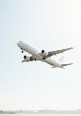 Obraz premium Commercial airplane taking off against a clear sky at an airport