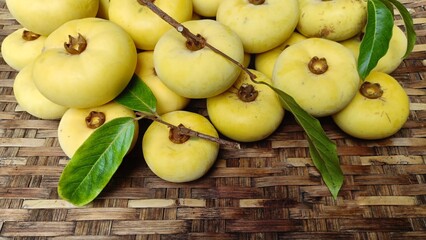 Gold apple on woven bamboo