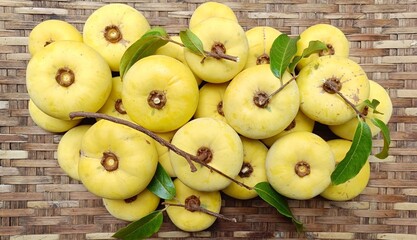 Gold apple on woven bamboo