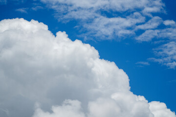 **Bright Cumulus Clouds in a Blue Sky**