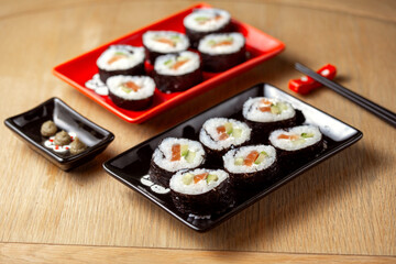 Homemade sushi with salmon, avocado and cucumber