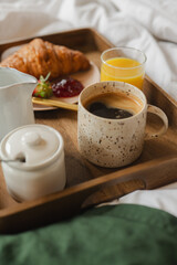 Coffee, Orange Juice and Croissant in bed