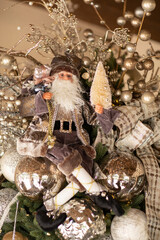 Detail of Santa elf in ornate Christmas tree