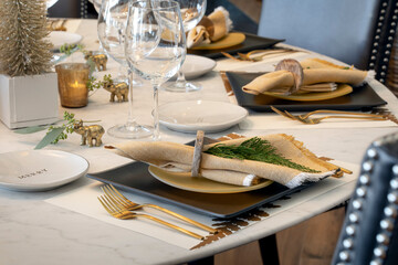 Holiday table place settings ready for a gathering